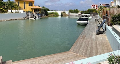 Private condo, water views, great breezes, well appointed for divers