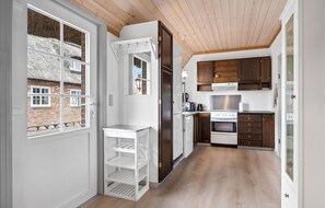 Fridge, stovetop, dishwasher, coffee/tea maker