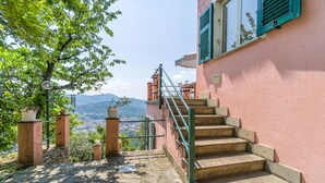 A staircase leading to a building with a view of a city and mountains. - 3 bedroom gorgeous home in Rapallo (Rapallo)