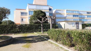 A multi-story building with a sign reading "les florales".