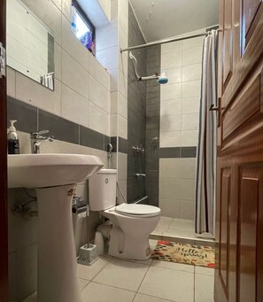 Shower, hair dryer, towels, soap