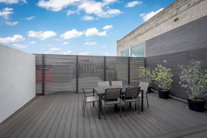 Enjoy casual dining on the deck surrounded by lush greenery and a stunning view.