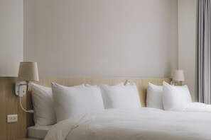 Chambre triple Confort | Literie de qualité, couette en duvet