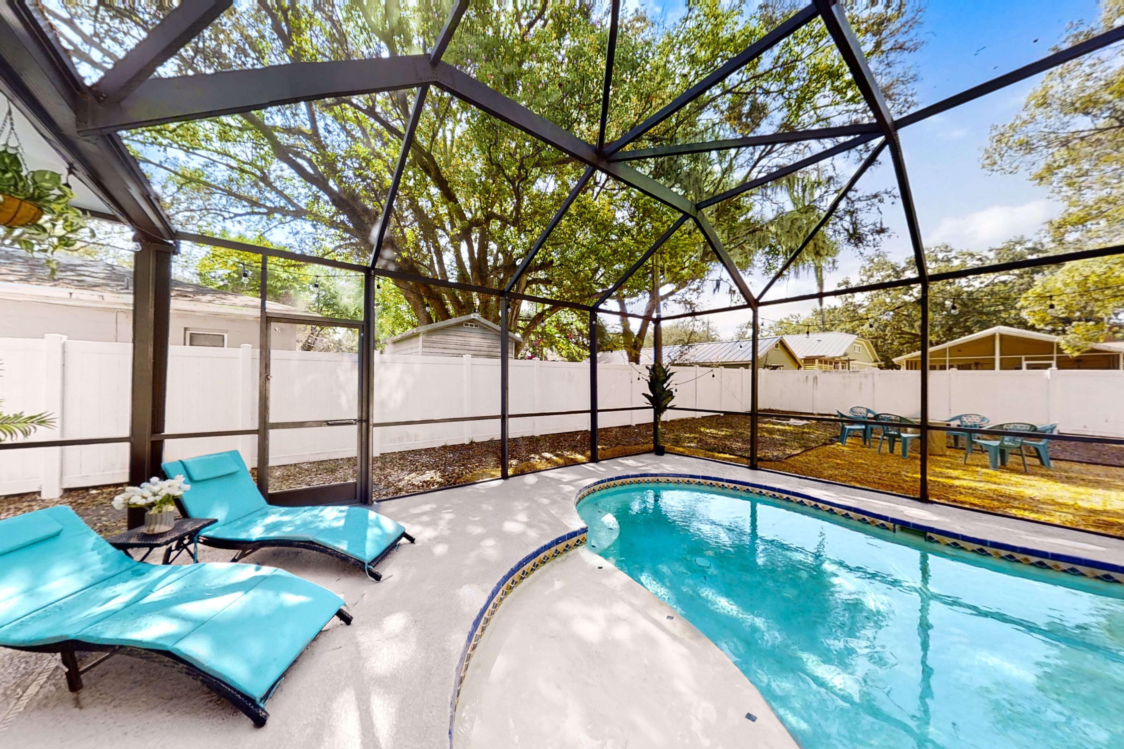 Bright & airy home with screened private pool, grill, & fenced yard