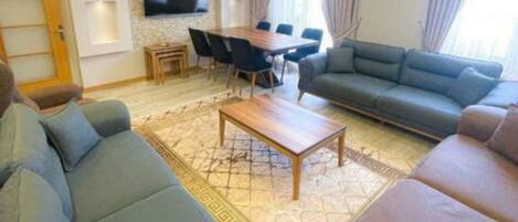 Family Apartment | Living area | 70-cm LCD TV with digital channels