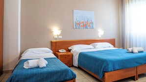 A hotel room with two beds, a nightstand, a painting on the wall, and a window with curtains. - HOTEL BELVEDERE (Canicatti)