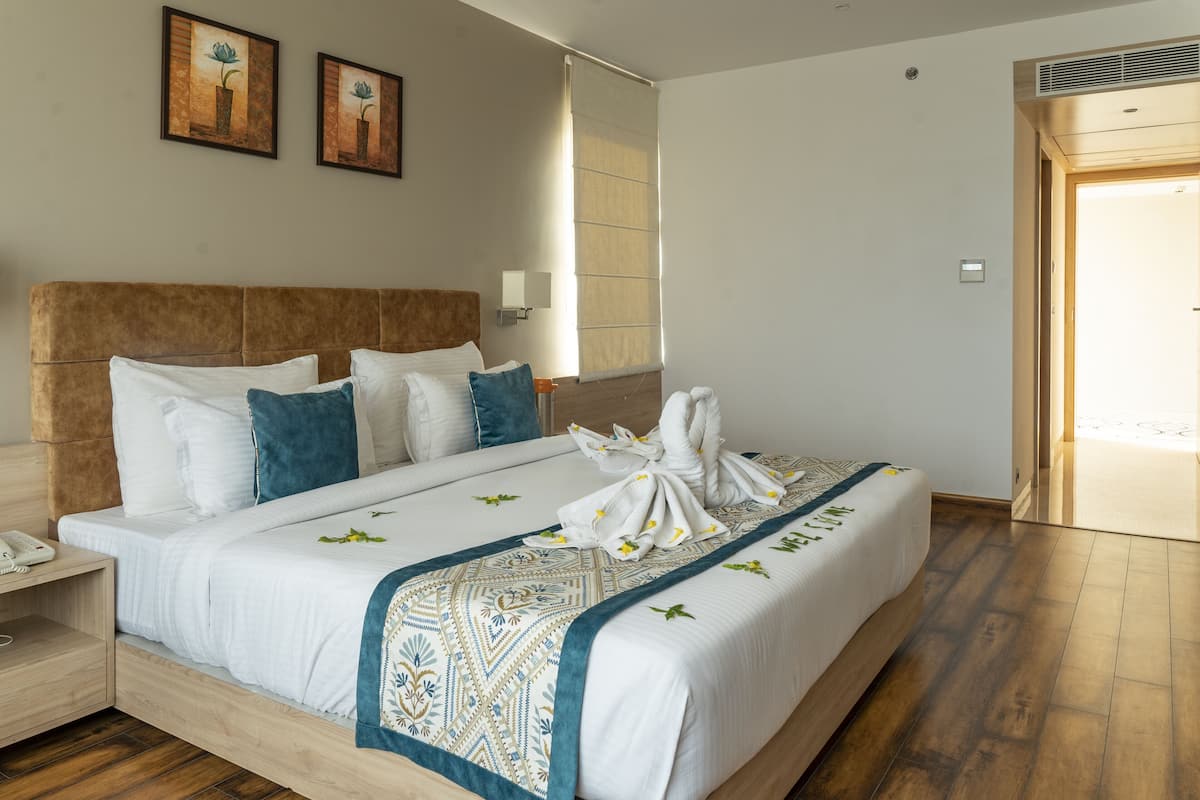 Chambre Double Deluxe | Literie de qualité supérieure, fer et planche à repasser