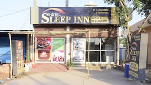 A hotel named 'Hotel Sleep Inn' with a signboard advertising room and restaurant services. - Hotel Sleep Inn    (Sonepat)