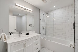 Bathtub, hair dryer, towels