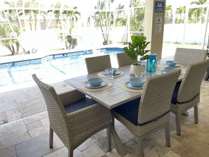Outdoor dining - Pelican area 3 bdrm home with heated pool. Close to beach and downtown. (Cape Coral)