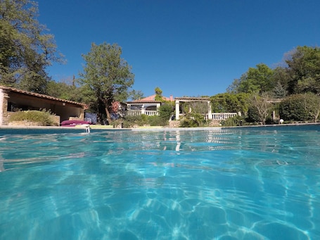 Seasonal outdoor pool, pool umbrellas, pool loungers. Les Secrets du Defends