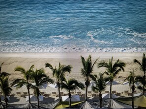 On the beach, sun loungers, beach towels