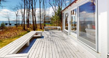 Oceanfront retreat with sunrise views, screened porch, & deck