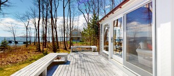 Oceanfront retreat with sunrise views, screened porch, & deck