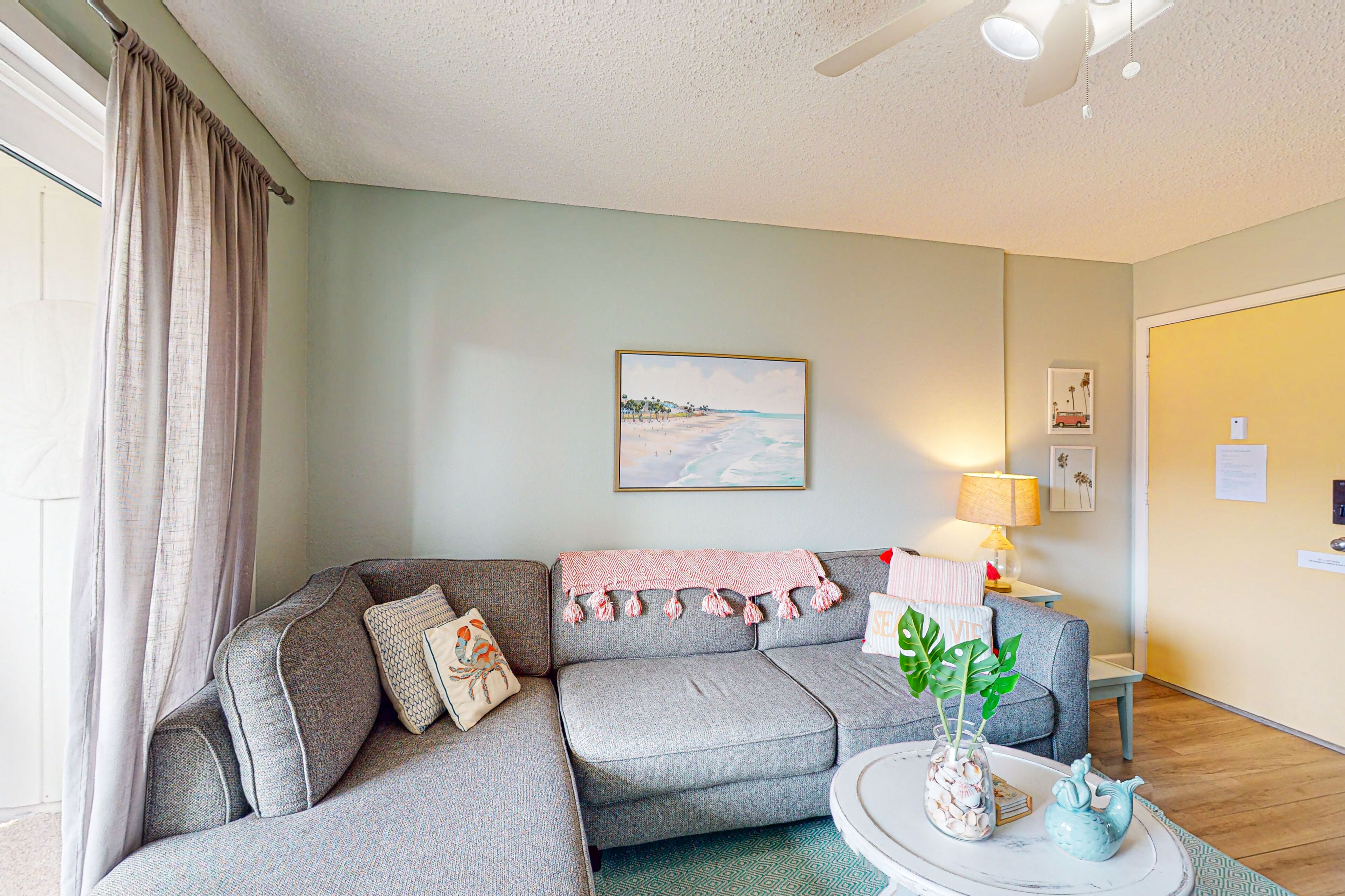 Charming condo with shared outdoor pool, board games, balcony, & W/D