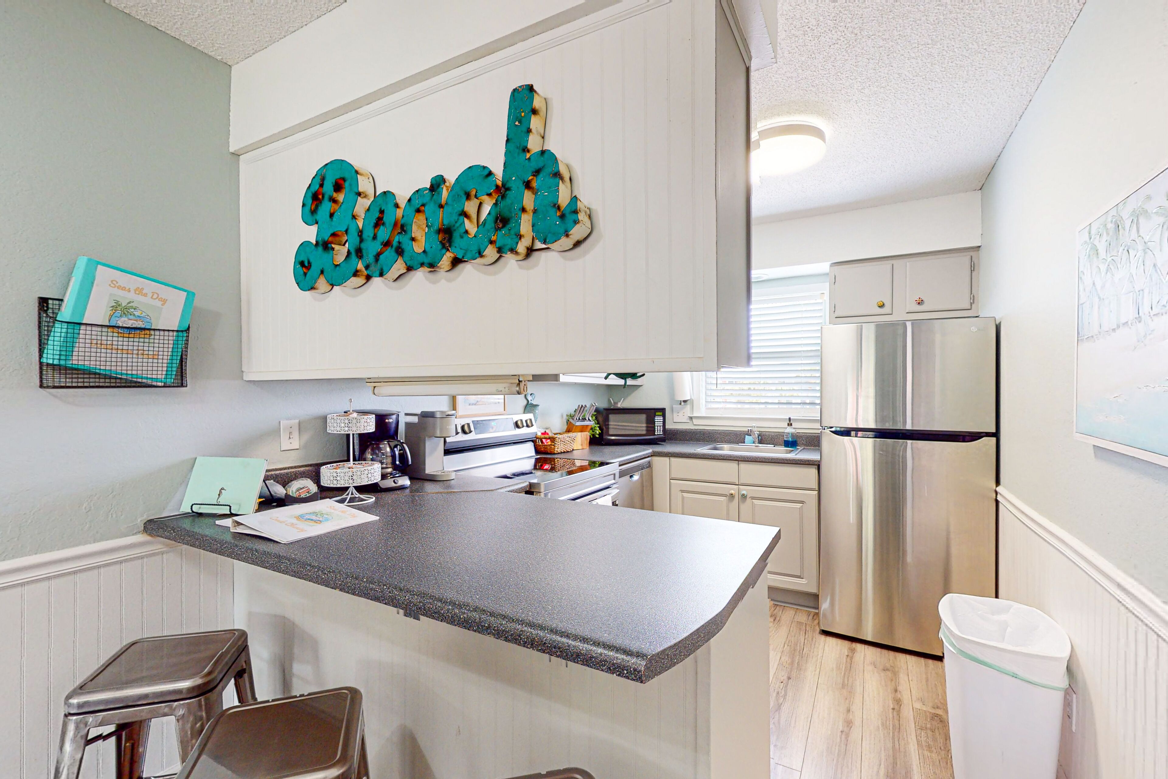 Charming condo with shared outdoor pool, board games, balcony, & W/D