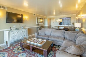 Deluxe Condo | Living room | 32-inch flat-screen TV with cable channels, TV - The Colony Virginia Beach by TripForth (Virginia Beach)