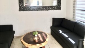 Basic Apartment, 2 Bedrooms, Pool Access | Living area | 36-inch LED TV with cable channels, TV - La Vida es Hoy (Playas de Rosarito)