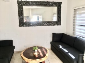 Basic Apartment, 2 Bedrooms, Pool Access | Living area | 36-inch LED TV with cable channels, TV - La Vida es Hoy (Playas de Rosarito)