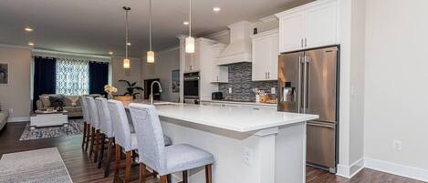 Fridge, coffee/tea maker, cookware/dishes/utensils