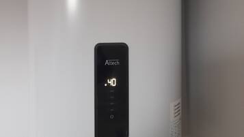 A white, modern, cylindrical device with a digital display reading "Altech 40 MAX ECO" and a power button below.