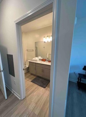 Shower, hair dryer, towels, toilet paper