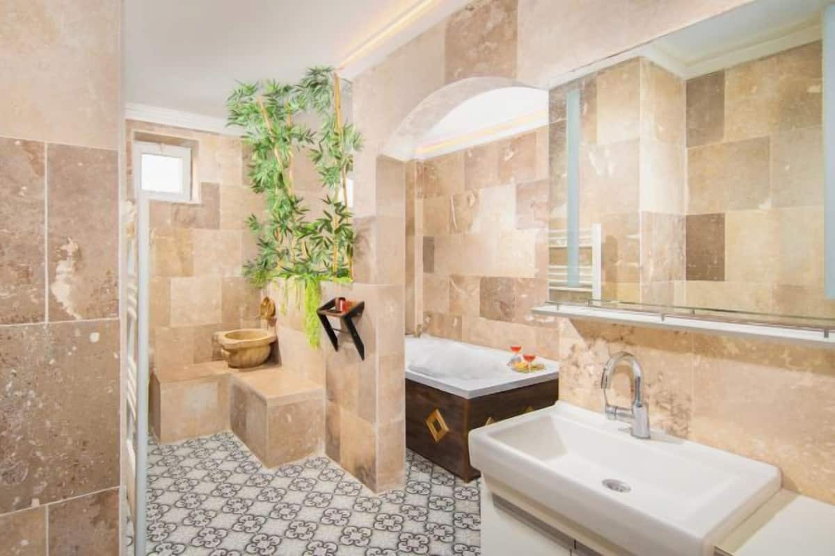 Bathroom | Designer toiletries, hair dryer, bathrobes, slippers