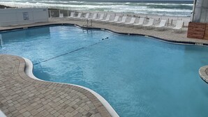 A swimming pool with a view of the ocean, a lifeguard stand, and lounge chairs along the poolside. - Studio condo on beach at Historical Fontainebleau Terrace. Sleeps 4.Full Kitchen (Panama City Beach)