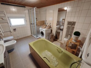 Bidet, towels, toilet paper