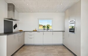 Fridge, stovetop, dishwasher, coffee/tea maker
