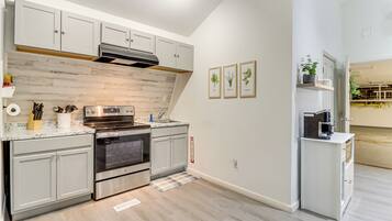 Fridge, microwave, stovetop, coffee/tea maker