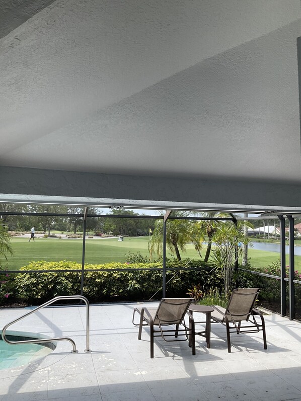 Relax by the pool overlooking the adjacent golf course.