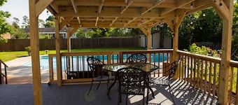 Oasis in the middle of town for large groups with pool and 2 Master bedrooms.