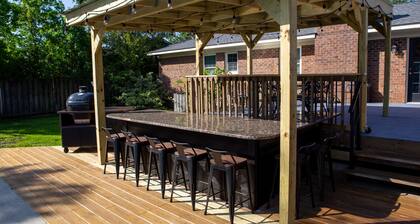 Oasis in the middle of town for large groups with pool and 2 Master bedrooms.