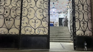 An ornate metal gate with intricate designs and a staircase leading inside. - Premier Pyramids Inn (Giza)