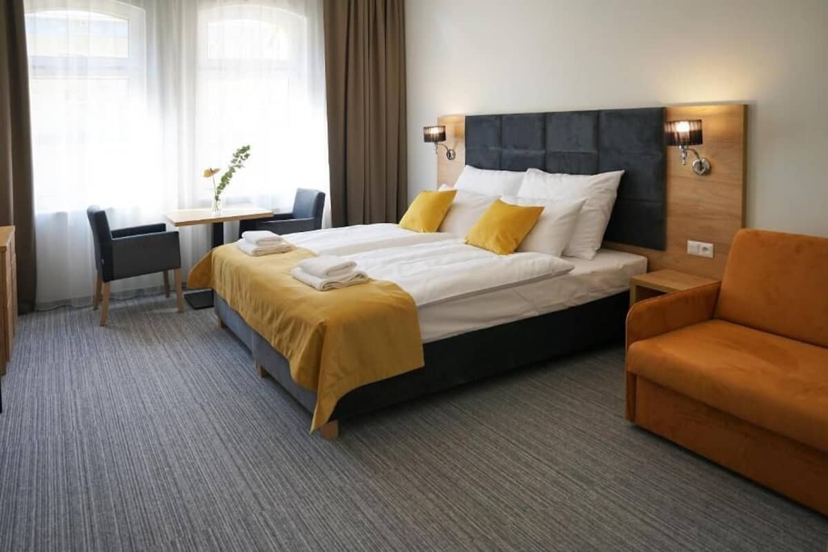 Comfort Triple Room, City View | In-room safe, blackout drapes, soundproofing