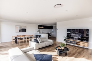 Deluxe Apartment | Living area | 42-inch flat-screen TV with digital channels, TV - Little Island Apartments (Bellerive)