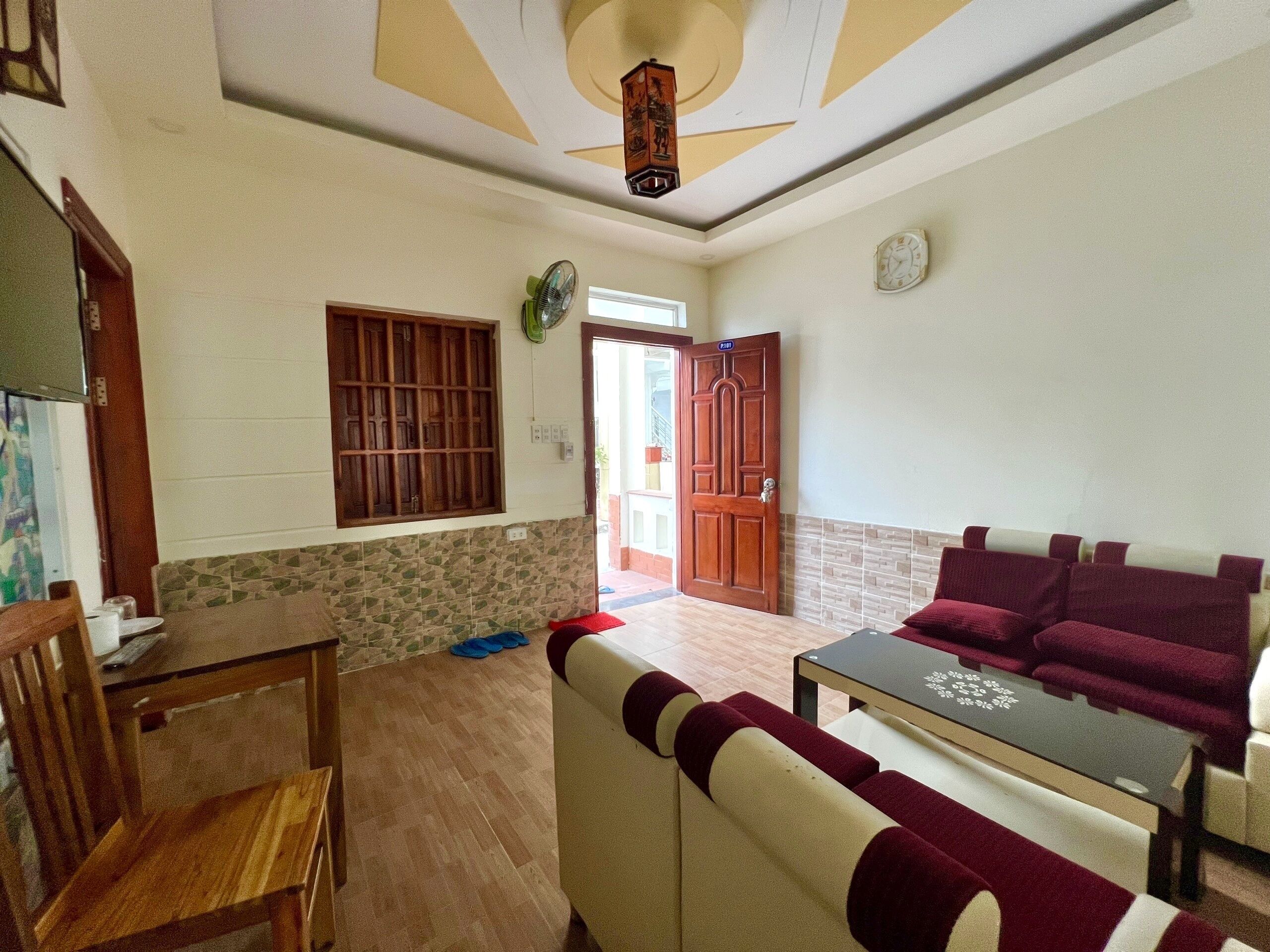 family quadruple room | living area | flat-screen tv