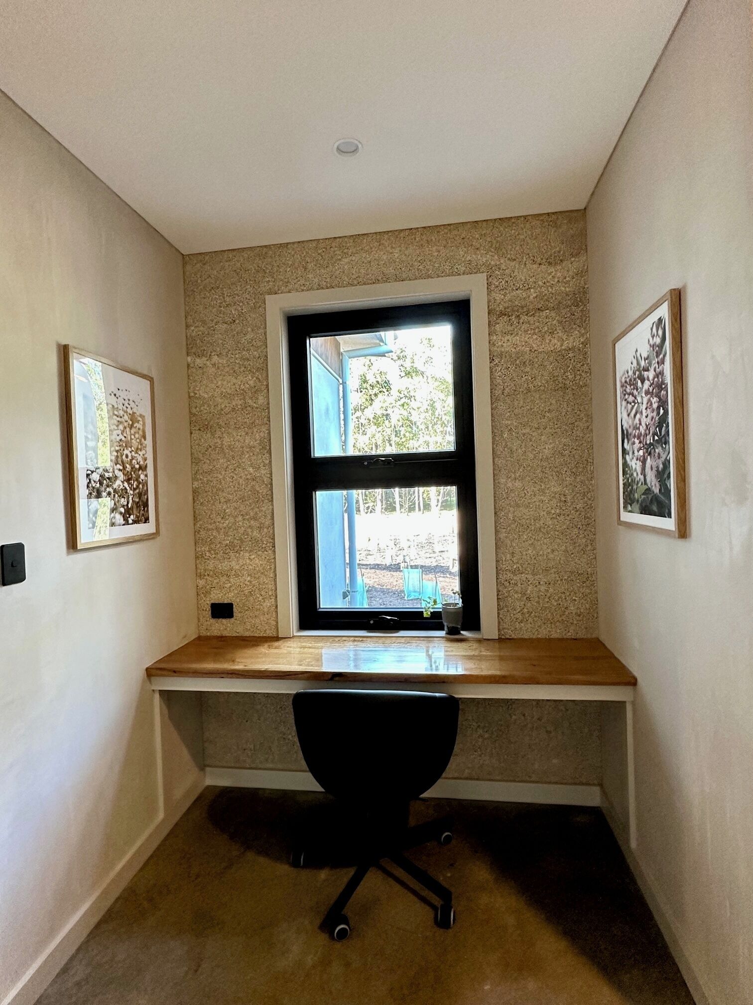 Study nook overlooking garden and forest view beyond