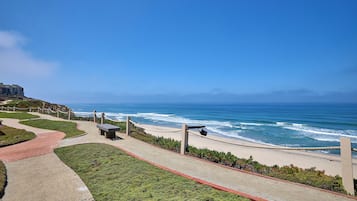 On the beach, sun loungers, beach towels
