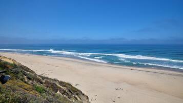 On the beach, sun loungers, beach towels