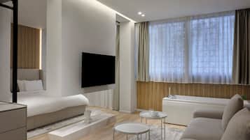 Junior Suite with Hot Tub | Living room | 50-inch Smart TV with cable channels, TV