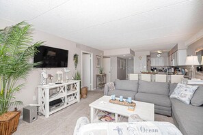 Living area - Swanky 2 Bedroom Oceanfront Condo with Outdoor Pool, WiFi, and Great Beach View from open balcony. Linen & towels included. (Ocean City)