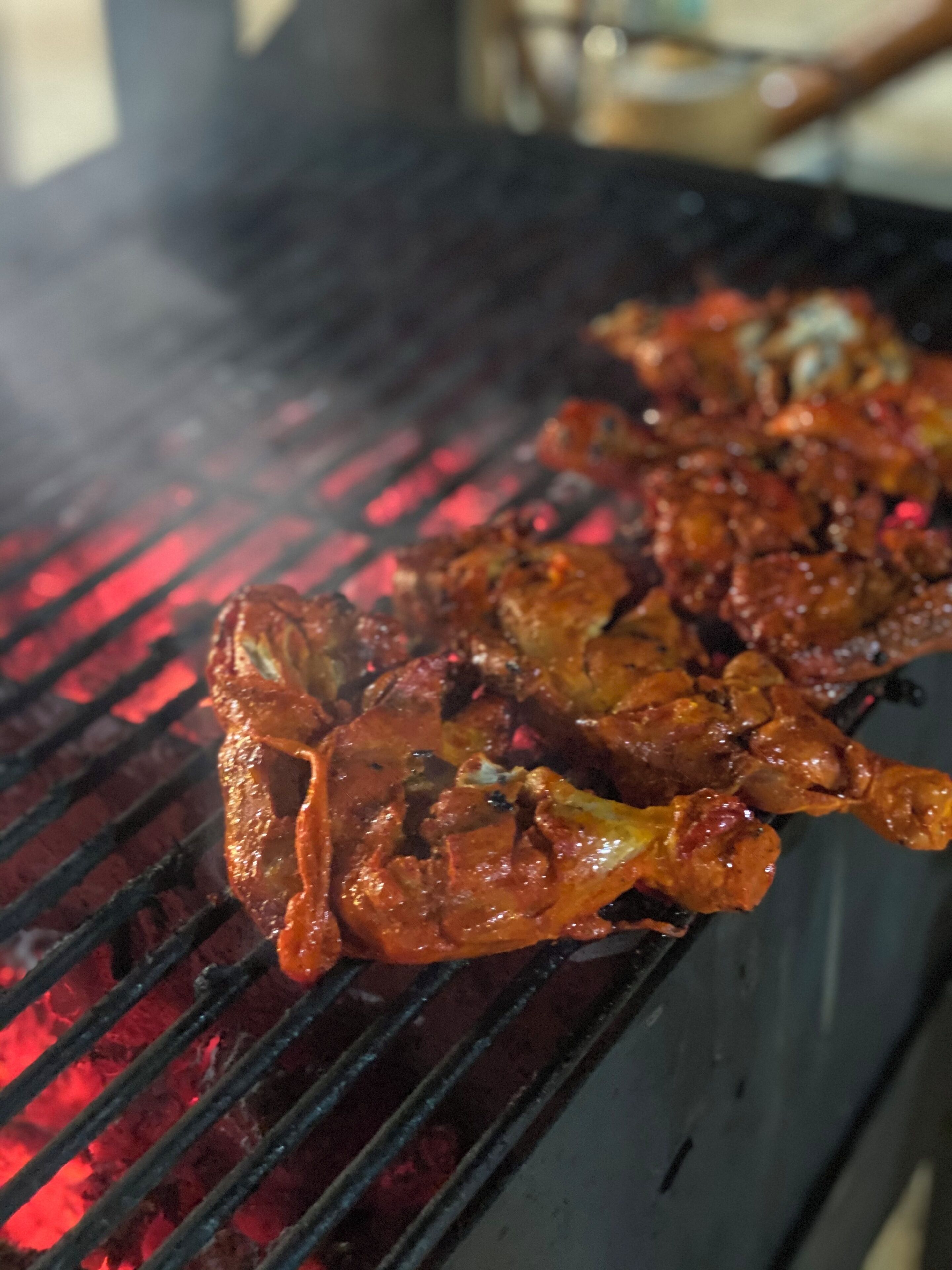 A grill with food being cooked.