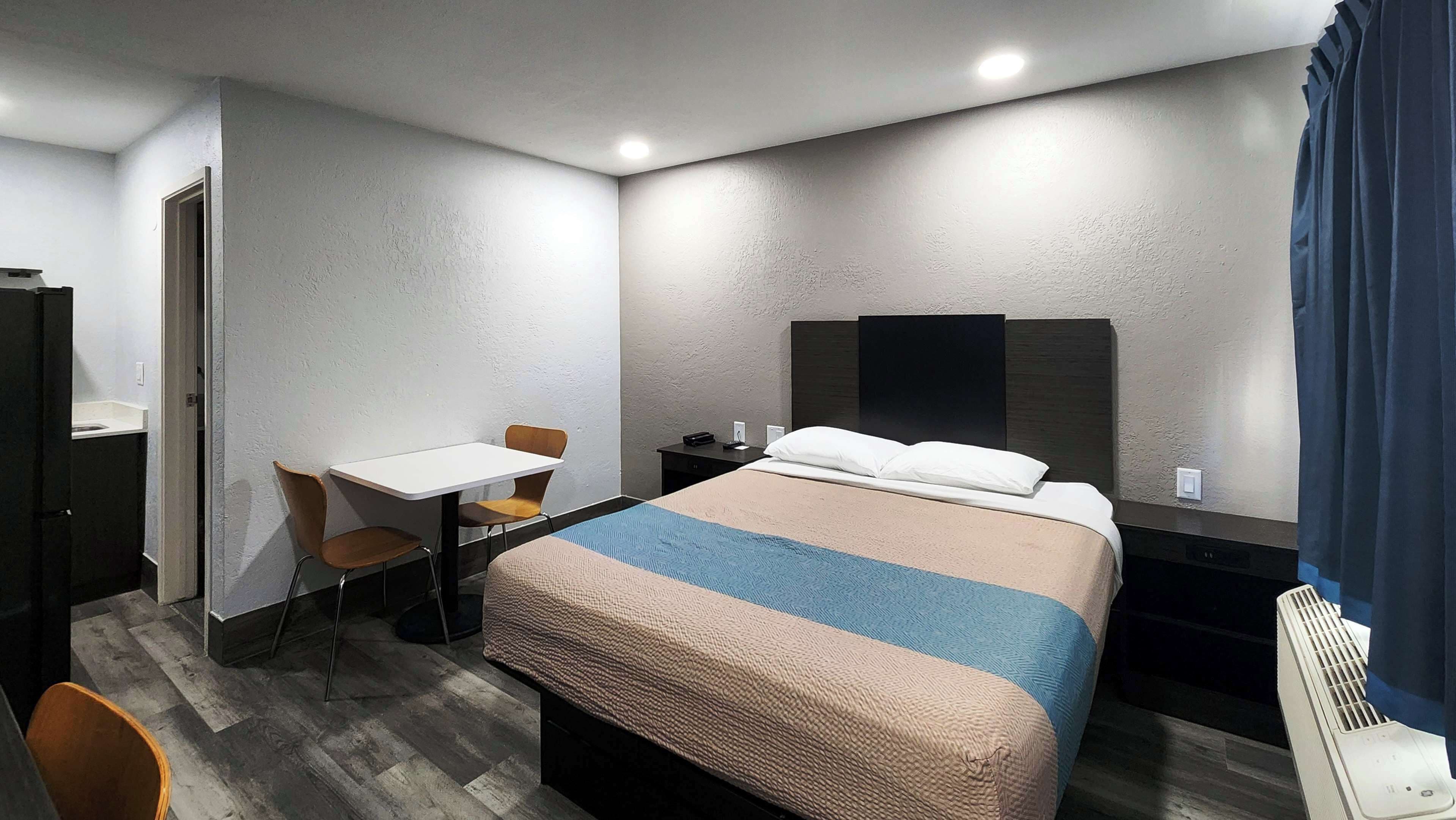 Desk, laptop workspace, blackout curtains, iron/ironing board