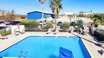 Outdoor pool, pool umbrellas, sun loungers