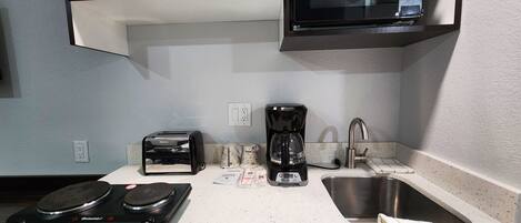 Desk, laptop workspace, blackout curtains, iron/ironing board