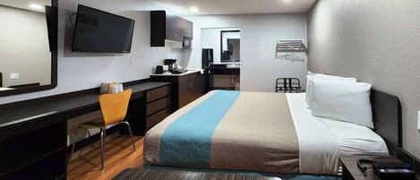 Desk, laptop workspace, blackout drapes, iron/ironing board