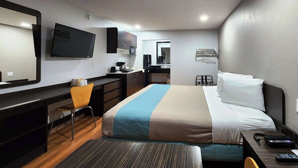 Desk, laptop workspace, blackout drapes, iron/ironing board