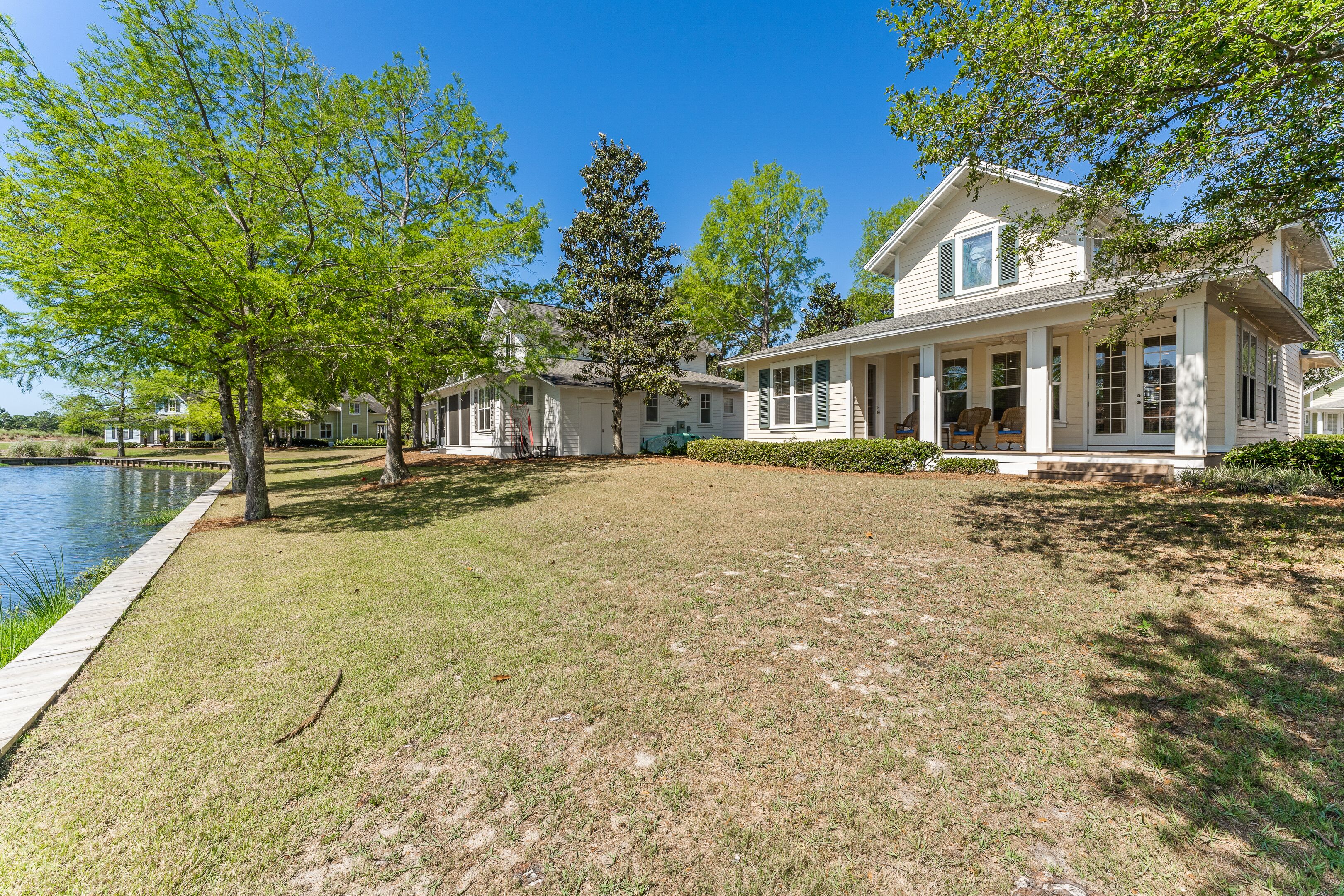 Charming Lakeside Beach Cottage w/ New 6-SEAT GOLF CART, Porch, Pool, Hot Tub